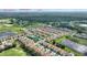 Aerial view of the community showing the pool, golf course and location near popular destinations like Disney at 1064 Quaker Ridge Ln, Davenport, FL 33896