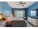 Stylish bedroom with a king-size bed, modern furnishings, and natural lighting at 1064 Quaker Ridge Ln, Davenport, FL 33896