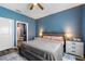 Cozy bedroom with a king-size bed, bedside tables, and an ensuite bathroom at 1064 Quaker Ridge Ln, Davenport, FL 33896