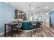 Open kitchen featuring bar seating, pendant lighting, and modern finishes at 1064 Quaker Ridge Ln, Davenport, FL 33896