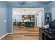 View of open living space showcasing kitchen, bar seating, and view of another room at 1064 Quaker Ridge Ln, Davenport, FL 33896