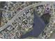 Aerial view of neighborhood with lake and home in a desirable location at 108 Honeywood Ct, Kissimmee, FL 34743