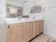 Bathroom with a double sink vanity, large mirror, and a glass-enclosed shower at 108 Honeywood Ct, Kissimmee, FL 34743