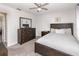 Cozy bedroom with a dark wood dresser, neutral carpet, and a comfortable bed at 108 Honeywood Ct, Kissimmee, FL 34743