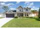 Charming two-story home with a well-maintained lawn and inviting curb appeal at 108 Honeywood Ct, Kissimmee, FL 34743