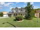 Charming two-story home with well-manicured lawn and mature landscaping at 108 Honeywood Ct, Kissimmee, FL 34743