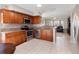 Well-equipped kitchen featuring stainless steel appliances and granite countertops at 108 Honeywood Ct, Kissimmee, FL 34743