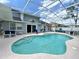 Large screened pool area with ample seating and serene backyard views at 108 Honeywood Ct, Kissimmee, FL 34743