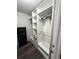 Custom walk-in closet with white shelving and plenty of storage and safe at 108 Honeywood Ct, Kissimmee, FL 34743