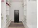 Well-organized walk-in closet with custom shelving, drawers and a security safe at 108 Honeywood Ct, Kissimmee, FL 34743