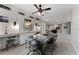 Spacious bonus room with built-in desks, shelving, television, and unique decor throughout the open area at 10950 Belle Maisons Dr, Orlando, FL 32832