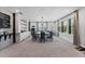 Open dining area with ample windows for natural light, with built-in shelving and decor at 10950 Belle Maisons Dr, Orlando, FL 32832