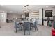 Dining area with a chandelier, comfortable seating, chalkboard wall, and a mini fridge at 10950 Belle Maisons Dr, Orlando, FL 32832