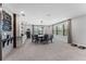 Dining room with table, chairs, bar area, and windows with natural light at 10950 Belle Maisons Dr, Orlando, FL 32832