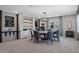 Stylish dining area featuring rustic decor elements, chalkboard accents, and a modern chandelier at 10950 Belle Maisons Dr, Orlando, FL 32832