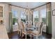 Bright dining area with large windows and stylish chandelier, perfect for Gathering gatherings at 10950 Belle Maisons Dr, Orlando, FL 32832