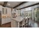 Kitchen featuring a large island with seating, stainless appliances, and bright cabinetry at 10950 Belle Maisons Dr, Orlando, FL 32832