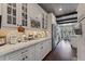 Bright kitchen featuring white cabinets, stainless steel appliances, and hardwood floors at 10950 Belle Maisons Dr, Orlando, FL 32832