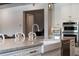 Bright kitchen with stainless steel faucet and appliances at 10950 Belle Maisons Dr, Orlando, FL 32832