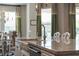 Bright and airy kitchen with a dining space and stainless steel faucet at 10950 Belle Maisons Dr, Orlando, FL 32832