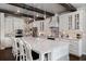 Kitchen featuring a large island, stainless appliances, and bright cabinetry at 10950 Belle Maisons Dr, Orlando, FL 32832