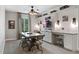 Home office space with built-in desks, accent lighting, and storage solutions for organized work at 10950 Belle Maisons Dr, Orlando, FL 32832