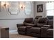 Inviting theater room featuring plush, reclining seats for a comfortable viewing experience at 10950 Belle Maisons Dr, Orlando, FL 32832