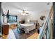 A cozy bedroom space is bright with natural light and a lovely decorative rug at 11951 Elbert St, Clermont, FL 34711