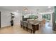 The kitchen flows to the dining room that offers seating at a wooden table for six at 11951 Elbert St, Clermont, FL 34711