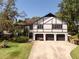 Multi-story home featuring a three-car garage and set in a well-maintained landscape at 11951 Elbert St, Clermont, FL 34711