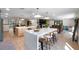 A sprawling kitchen featuring two islands, modern appliances and breakfast bar seating at 11951 Elbert St, Clermont, FL 34711