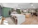 A kitchen with two islands featuring stainless steel appliances, and green cabinets at 11951 Elbert St, Clermont, FL 34711