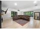 Spacious living room with modern furniture, large windows, and stylish flooring at 11951 Elbert St, Clermont, FL 34711