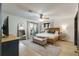Bright main bedroom with a sitting bench and hardwood flooring at 11951 Elbert St, Clermont, FL 34711