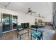 Covered patio with tile flooring, ceiling fans, and outdoor furniture at 11951 Elbert St, Clermont, FL 34711
