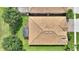An aerial view of the home's roof and screened lanai at 1353 Palmetto Dunes St, Davenport, FL 33836