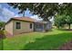 Lush backyard featuring a covered lanai, perfect for relaxation at 1353 Palmetto Dunes St, Davenport, FL 33836