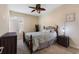 Bright bedroom with a bed, ceiling fan, and ample natural light from a window at 1353 Palmetto Dunes St, Davenport, FL 33836