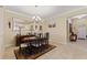 Formal dining room featuring a wooden table, stylish chairs, and elegant decor at 1353 Palmetto Dunes St, Davenport, FL 33836