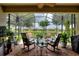 Relaxing screened patio overlooking the green outdoors at 1353 Palmetto Dunes St, Davenport, FL 33836