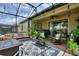 Beautiful covered patio with string lights, and comfortable furniture at 1353 Palmetto Dunes St, Davenport, FL 33836