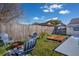 Backyard with a fire pit area, wood deck, small canopy and an in-ground swimming pool at 1375 Springfield St, Kissimmee, FL 34744