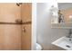 This modern bathroom features a glass-enclosed shower, sleek fixtures, and elegant tile work at 1375 Springfield St, Kissimmee, FL 34744