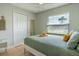 This bedroom features natural light, a comfortable bed, and neutral colors, creating a relaxing retreat at 1375 Springfield St, Kissimmee, FL 34744