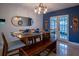 Dining room featuring a wooden table with seating for six and views to the back yard at 1375 Springfield St, Kissimmee, FL 34744