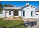 Charming single-story home with stucco exterior, arched entryway, and well-maintained front lawn at 1375 Springfield St, Kissimmee, FL 34744