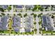 An aerial view of a neighborhood showing roof lines and surrounding trees and paved roads at 1379 Kiawah St, Celebration, FL 34747