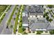Aerial view of townhomes along a palm-lined street, showcasing the community's layout at 1379 Kiawah St, Celebration, FL 34747