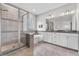 Elegant bathroom boasts tiled shower, soaking tub, double vanity, and modern fixtures at 1379 Kiawah St, Celebration, FL 34747