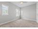Neutral bedroom with carpet, base molding, three windows, and ceiling fan at 1379 Kiawah St, Celebration, FL 34747